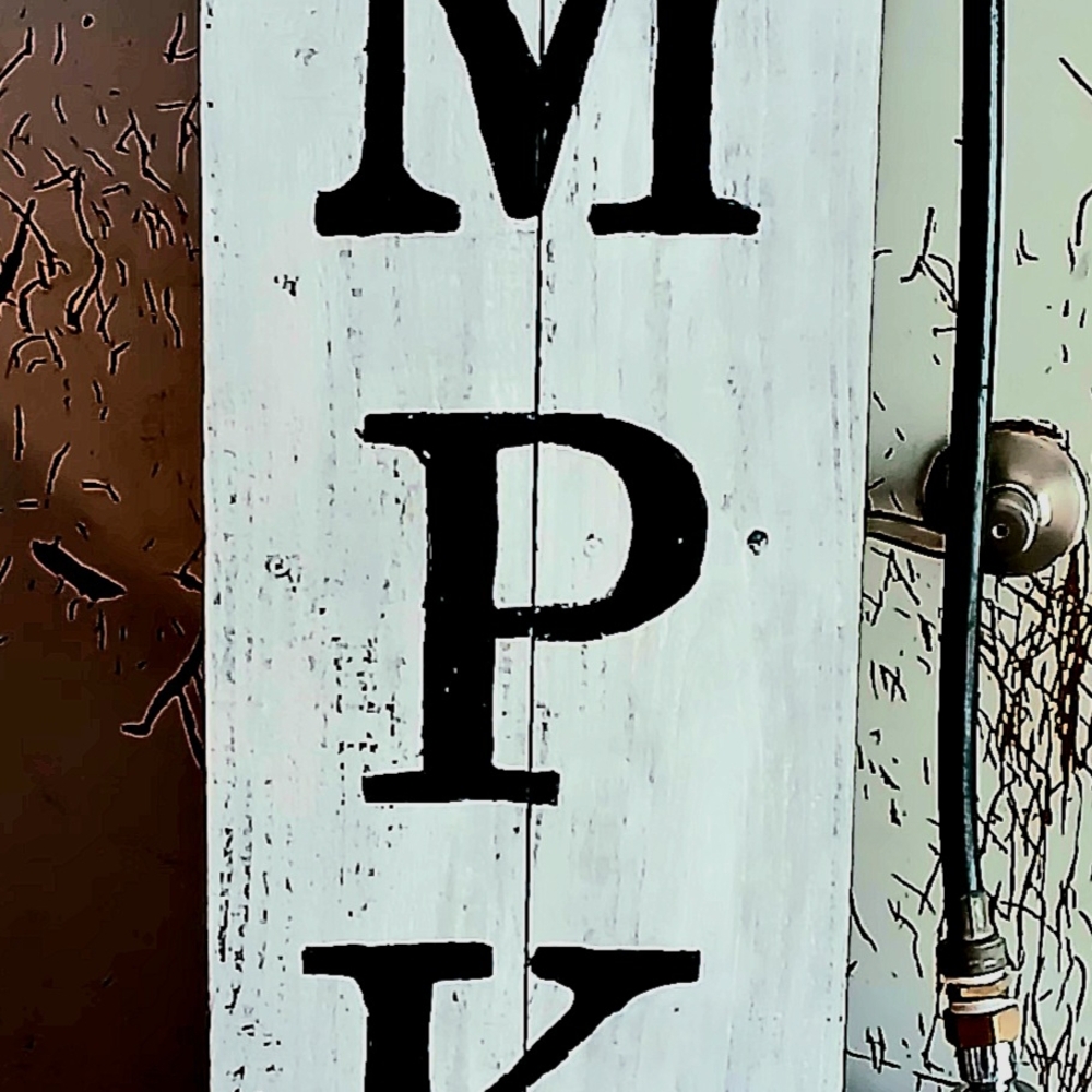 White Wooden Sign with Black Letters